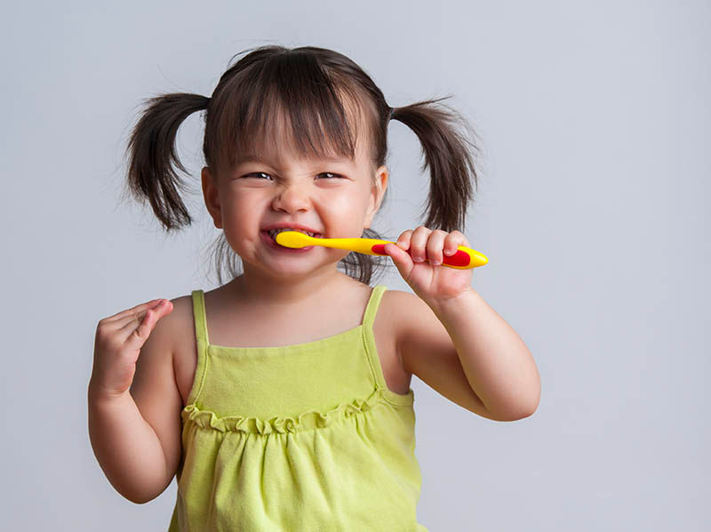 Child brushing teeth