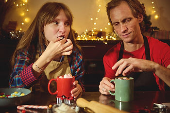 family drinking hot chocolate during christmas