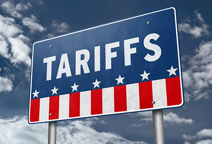Blue political sign reading TARIFFS in white, with stars and red-white stripes against a cloudy sky.
